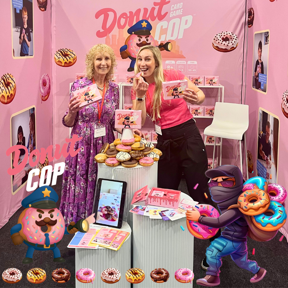 Kidstuff owners Dorothy and Kaitlyn posing at the Donut Cop Card Game stall
